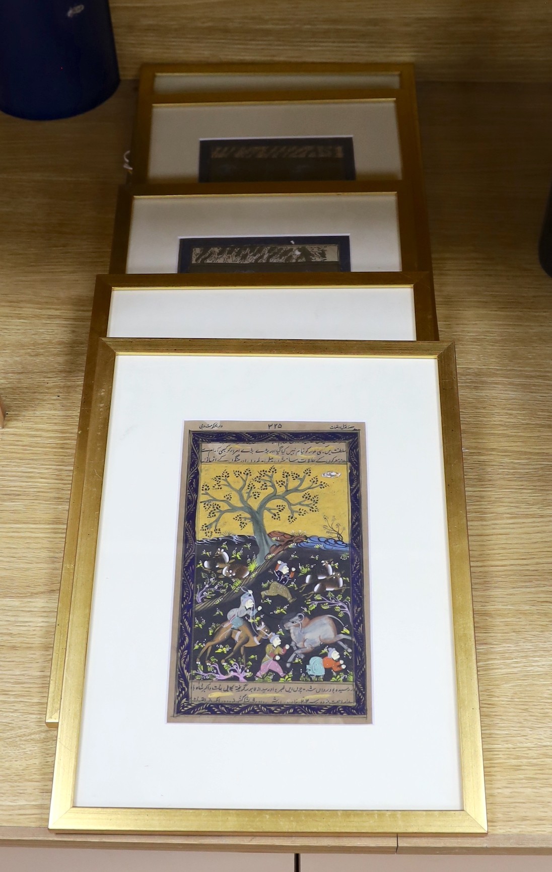 Persian School, five gouaches, Hunting scenes with inscriptions to the margins, 23 x 14cm